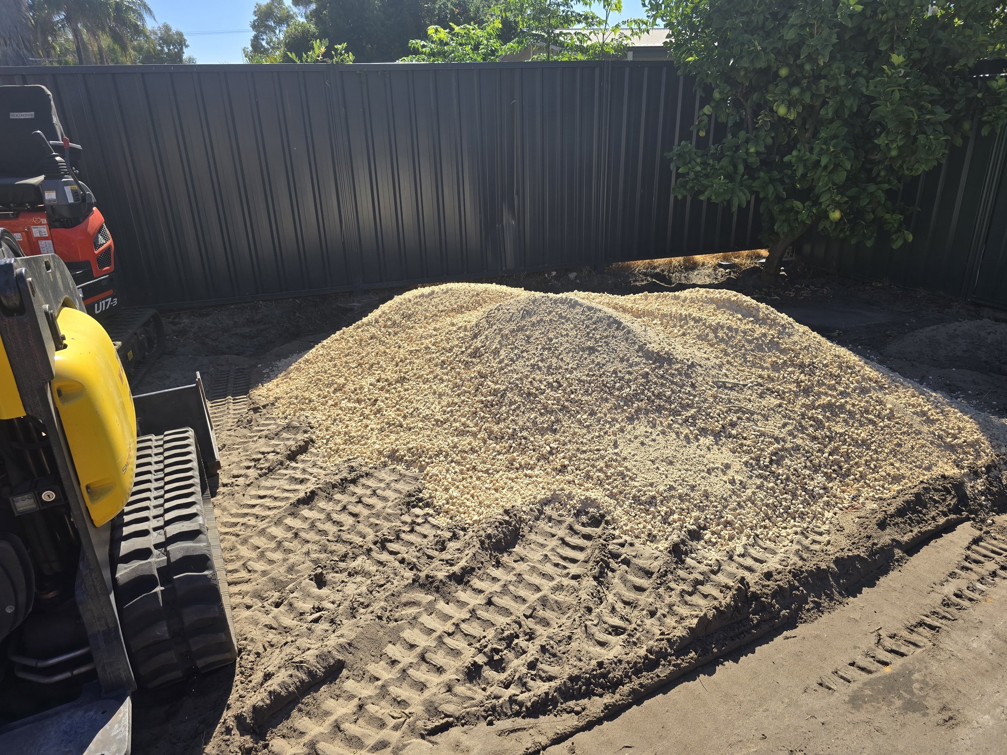 Material delivered and ready for spreading across the prepared area.